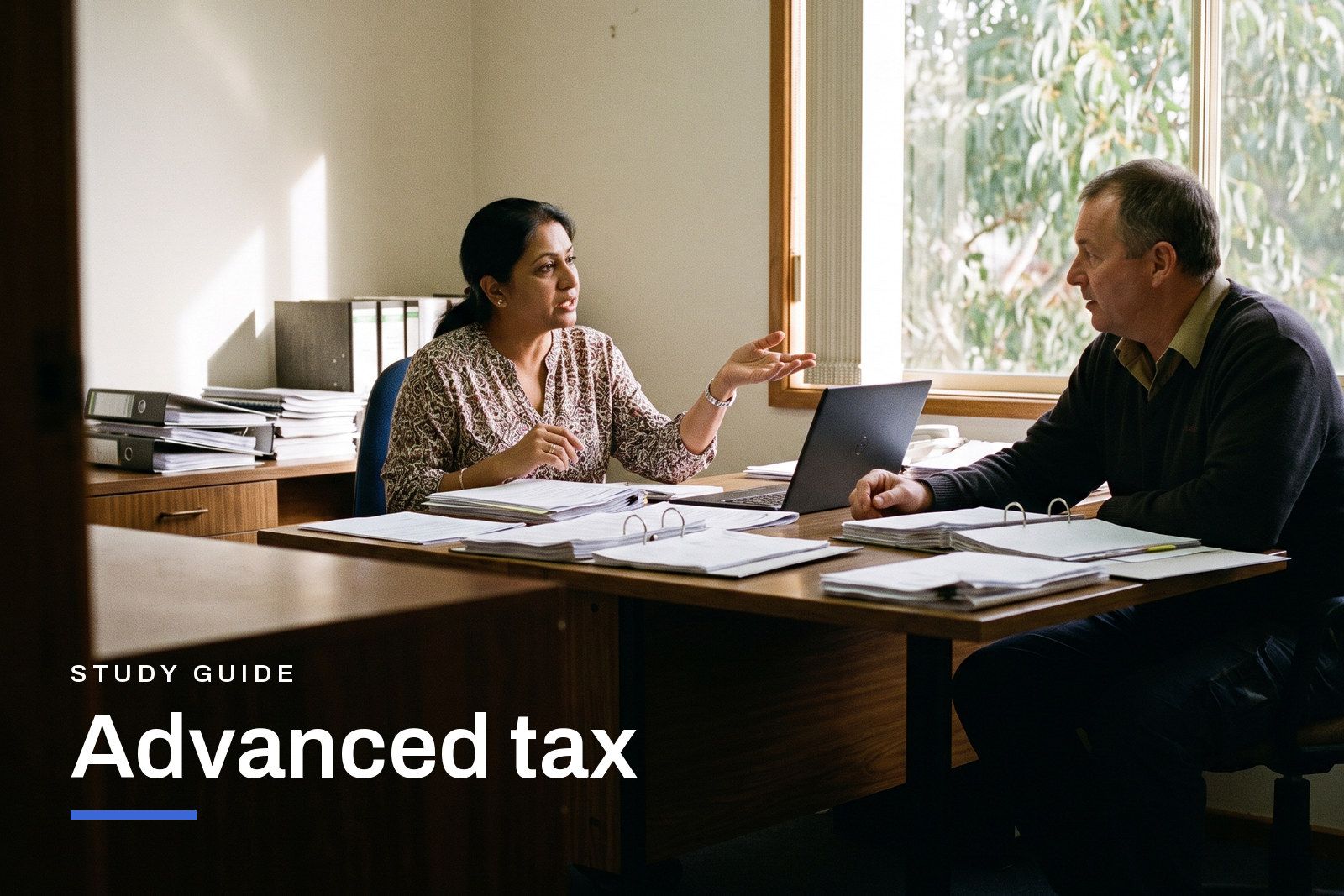 Advanced tax study guide header, a tax adviser talking a small business owner through an ownership structure in an Australian office.